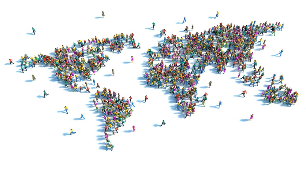 Människor som står i formationen av en världskarta.
